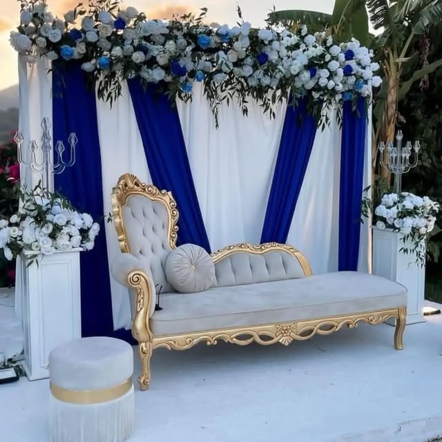 Gold and velvet lounge with blue and white floral backdrop